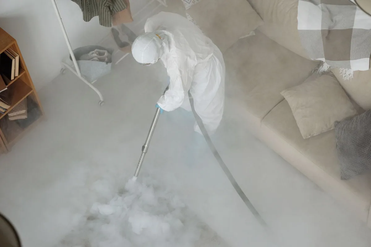 Biohazard cleanup technician in protective equipment, Cashton, WI